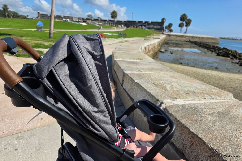 A young kid in a stroller outside the historic fort in St. Augustine